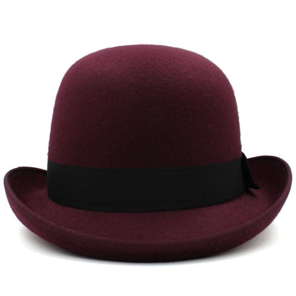 Maroon bowler hat with a black band on a white background