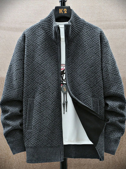 Gray textured cardigan on a mannequin with a beige background