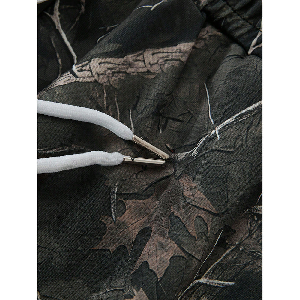 Camouflage print with white drawstrings.