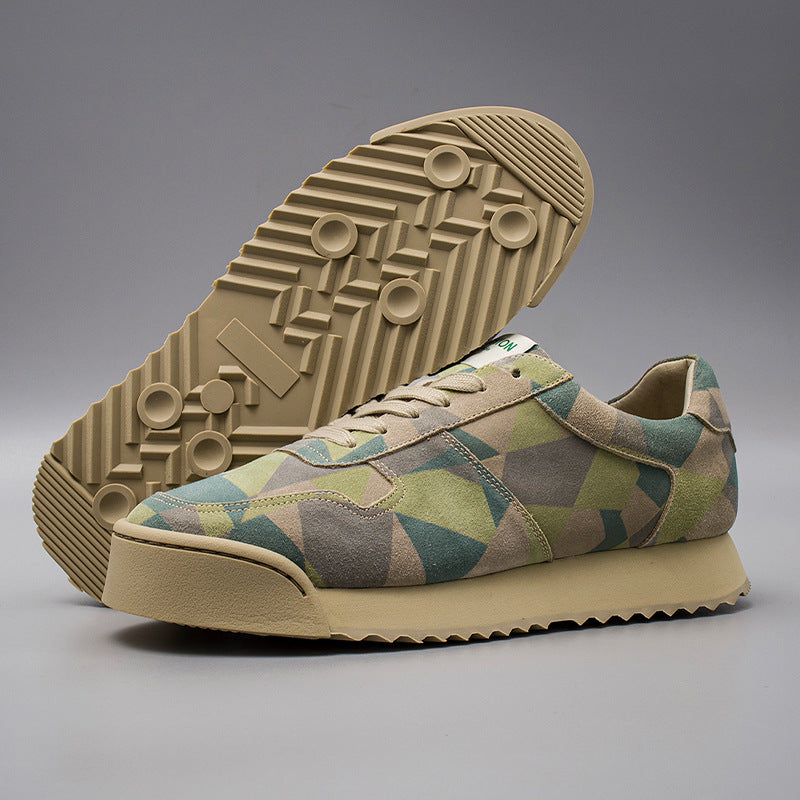 Geo patterned sneaker with beige sole on a gray background
