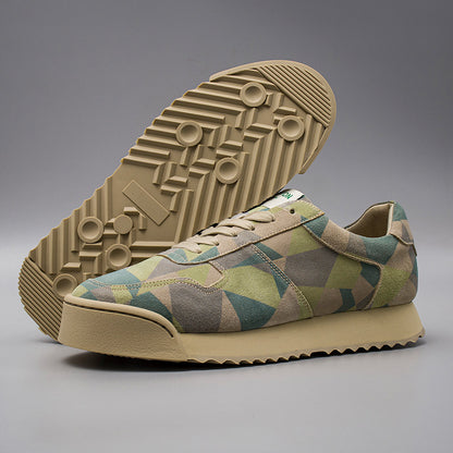 Geo patterned sneaker with beige sole on a gray background