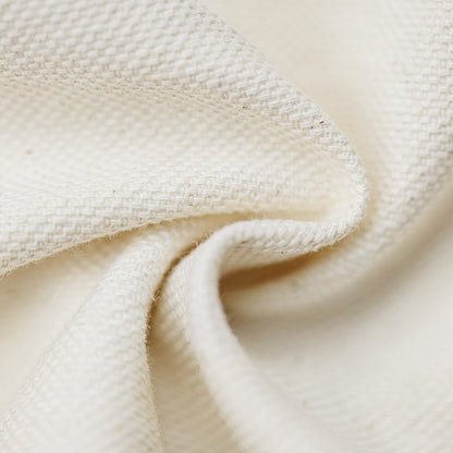 Close-up of beige fabric with a textured pattern