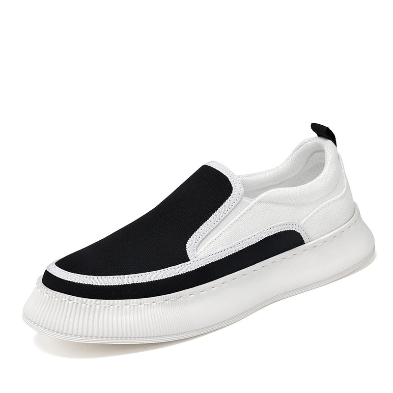 White slip-on sneaker with black stripes on a white background