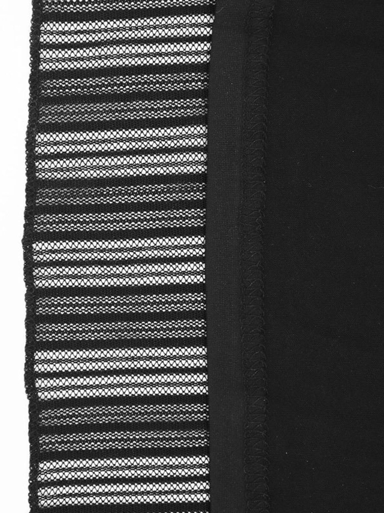 Close-up of a black and white striped fabric with a textured pattern.