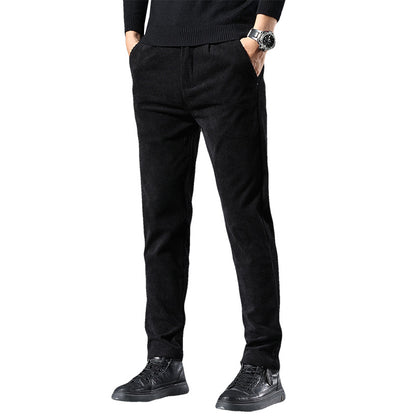 Black pants worn by a person on a white background