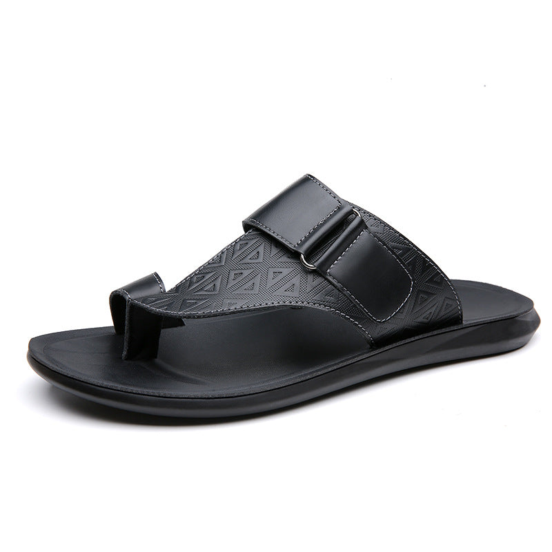 Black sandal with a geometric pattern on a white background