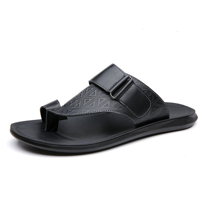 Black sandal with a geometric pattern on a white background