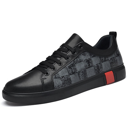Black sneaker with patterned side and red accent on a white background