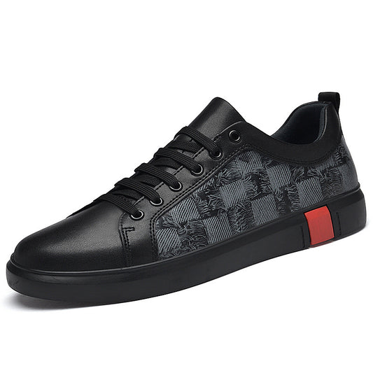 Black sneaker with patterned side and red accent on a white background