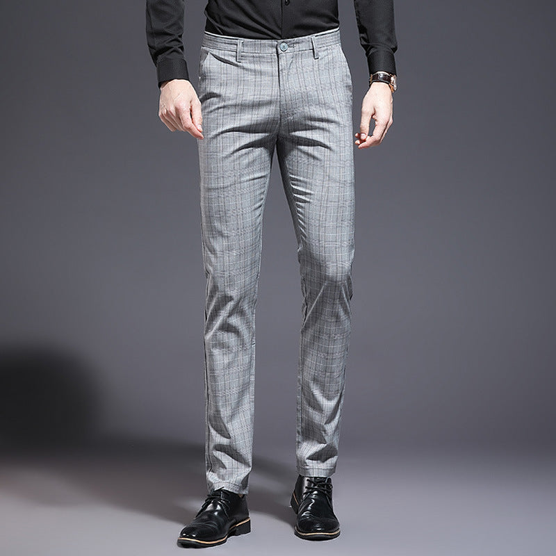 Gray checkered pants worn by a person on a gray background