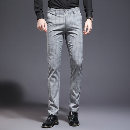 Gray checkered pants worn by a person on a gray background