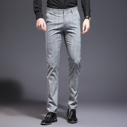 Gray checkered pants worn by a person on a gray background