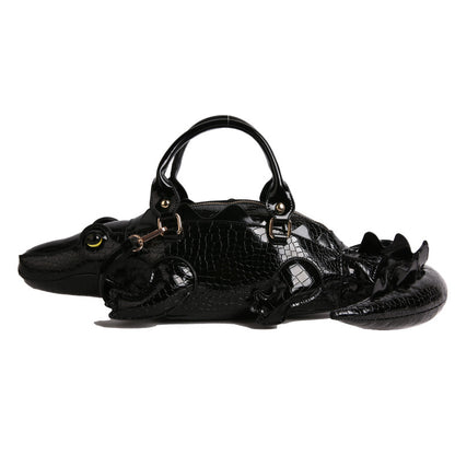 Black crocodile-shaped sandal on a white background