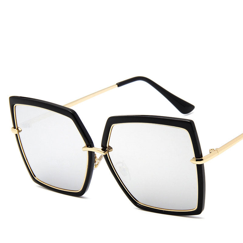 Sunglasses with black and gold frame on a white background