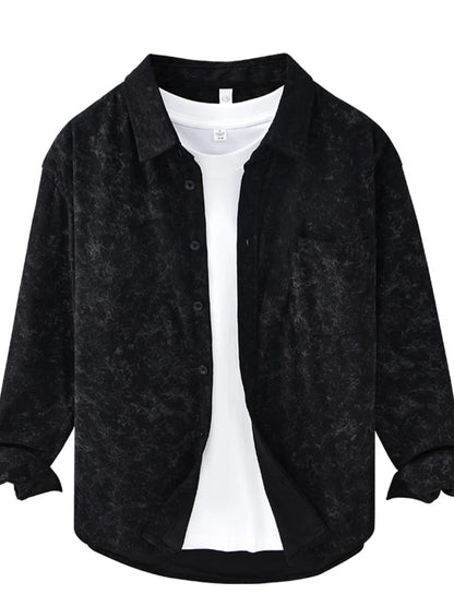 Black textured shirt over a white shirt on a white background