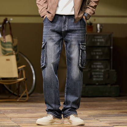 Person wearing blue cargo pants standing indoors with a blurred background
