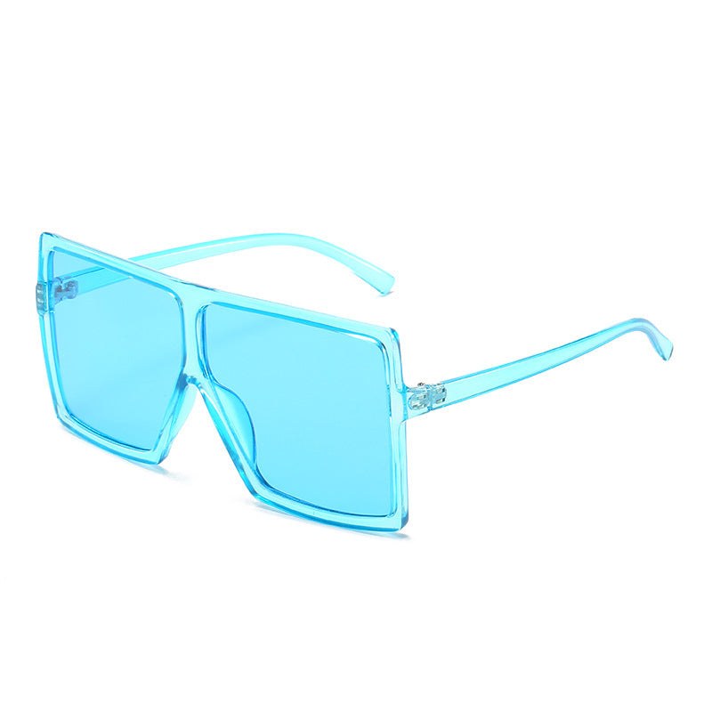 Blue sunglasses with a clear frame on a white background
