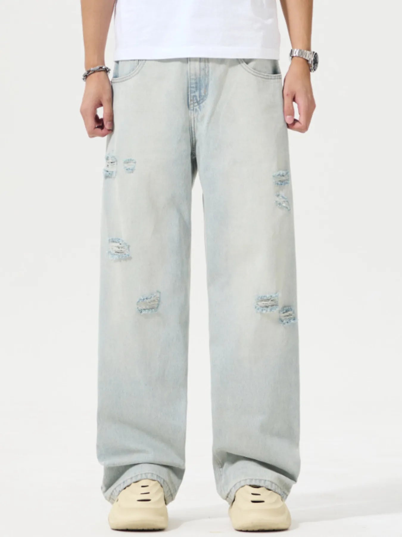 Light blue jeans worn by a person on a white background