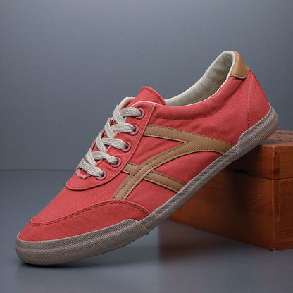 Red sneaker with brown accents on a gray background