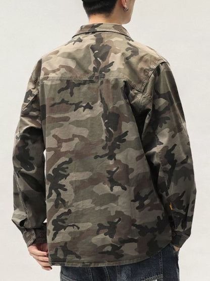 Person wearing a camouflage jacket on a plain background
