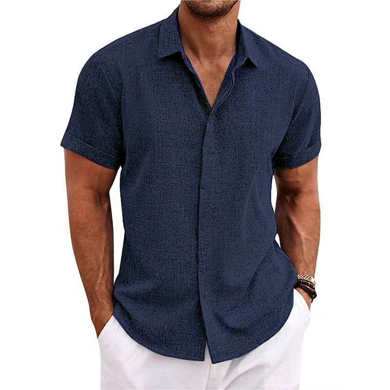 Man wearing a navy blue short-sleeve shirt on a white background