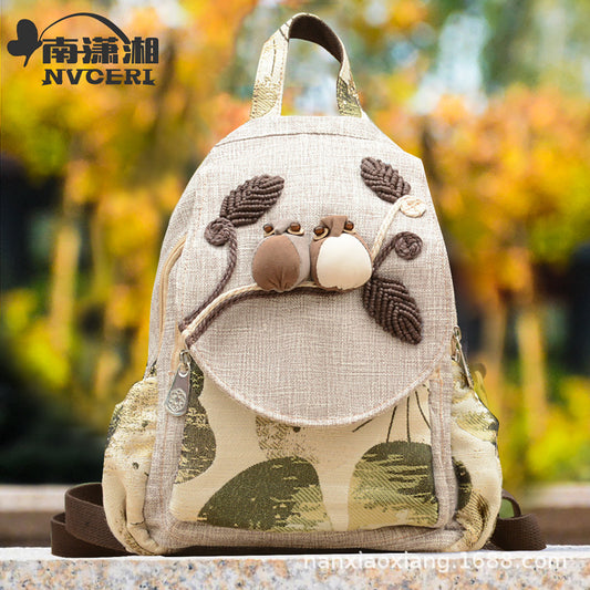 Backpack with animal design on a blurred natural background