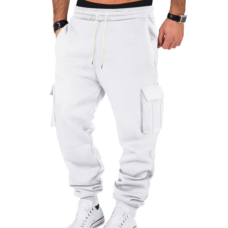 White cargo jogger pants worn by a person on a white background