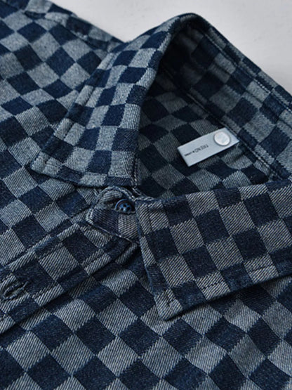 Close-up of a blue checkered shirt with a brand label.