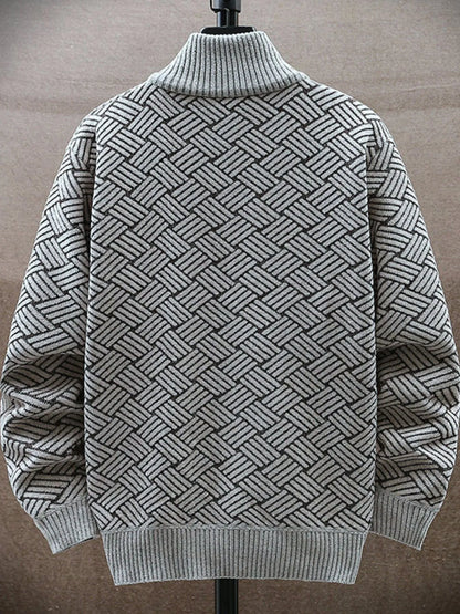 Gray sweater with geometric pattern on a mannequin against a neutral background