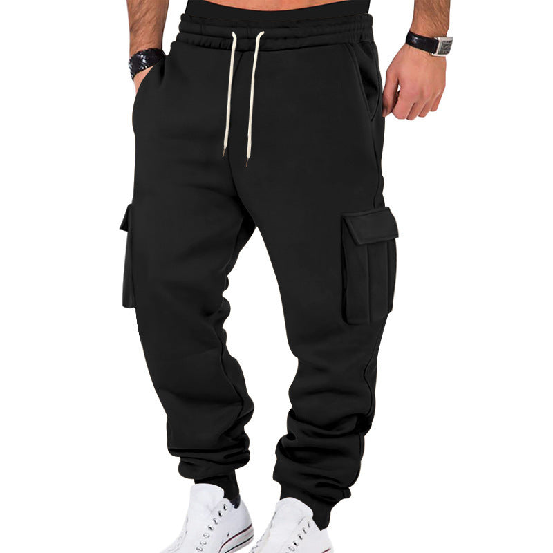 Black cargo pants worn by a person on a white background