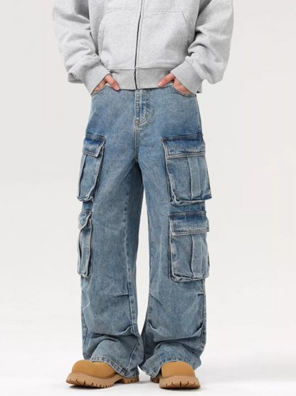 Person wearing a gray hoodie and blue cargo pants on a white background
