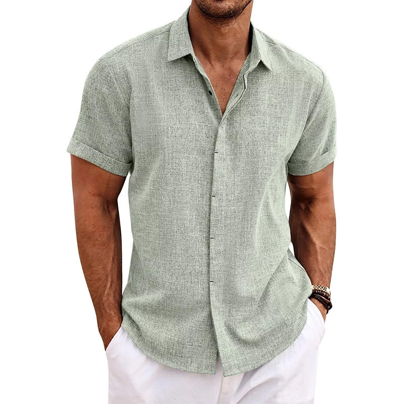 Man wearing a green short-sleeve shirt on a white background