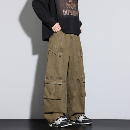 Person wearing olive green cargo pants with a black shirt and sneakers on a gray background