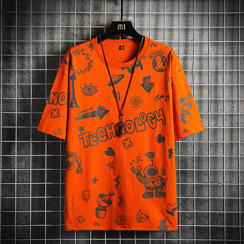 Orange t-shirt with black graphics and text on a hanger against a tiled wall.