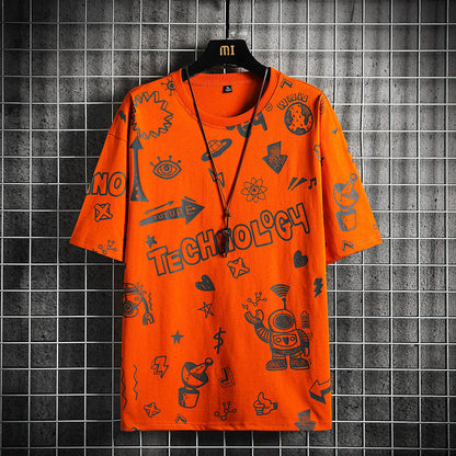 Orange t-shirt with black graphics and text on a hanger against a tiled wall.