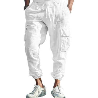 White cargo pants worn by a person on a white background