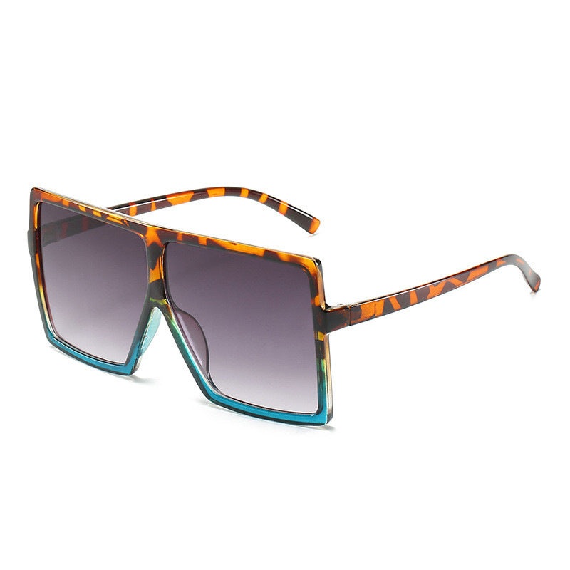 Sunglasses with a leopard print frame on a white background