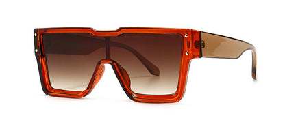 Brown sunglasses with a gradient lens on a white background