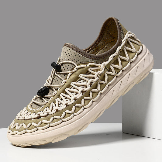 Beige sneaker with braided details on a gray background