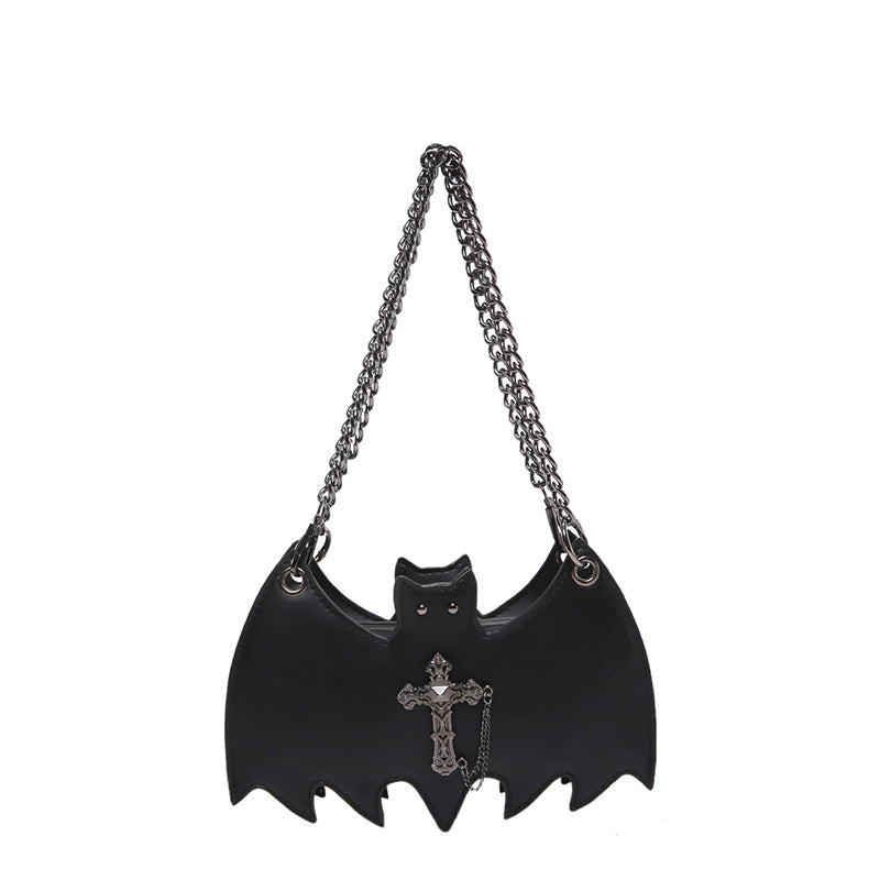 Handbag shaped as a bat on a white background.