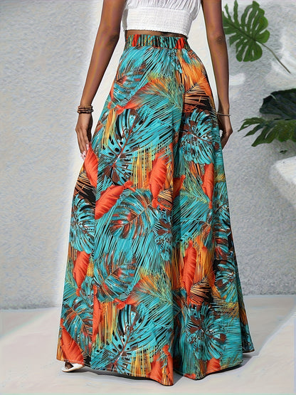Colorful tropical leaf patterned skirt worn by a person on a neutral background