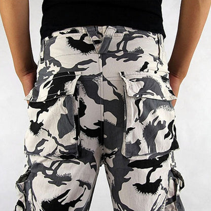 Camouflage cargo pants worn by a person on a white background