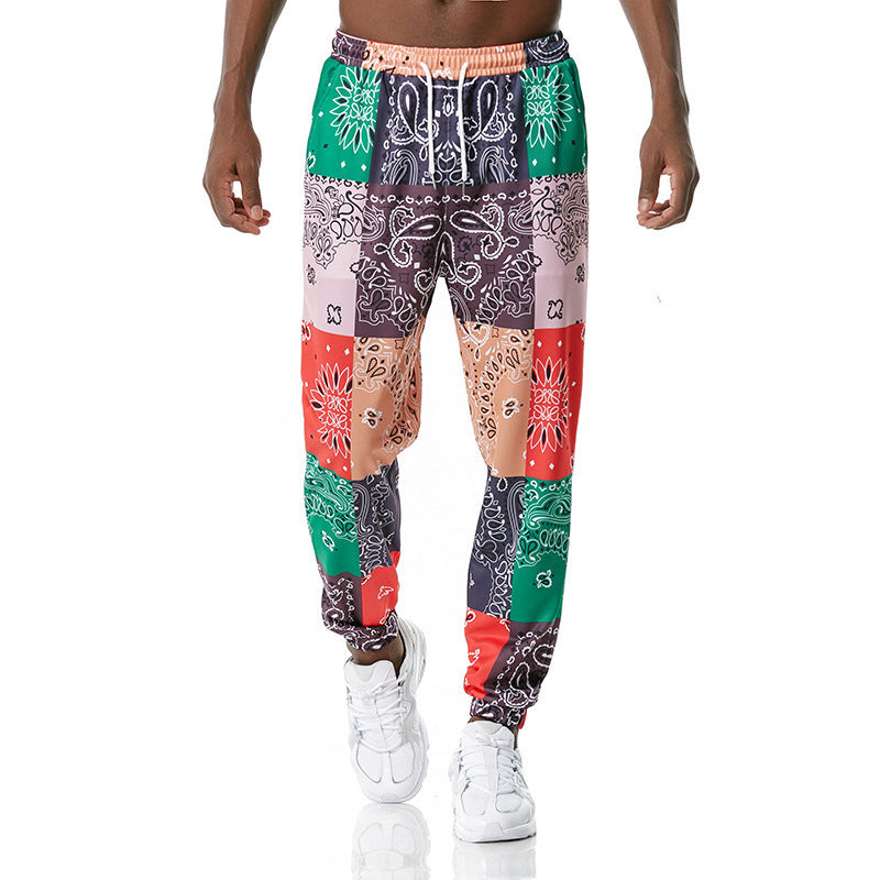Colorful patterned pants worn by a person on a white background