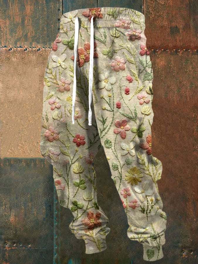 Floral embroidered pants on a textured background