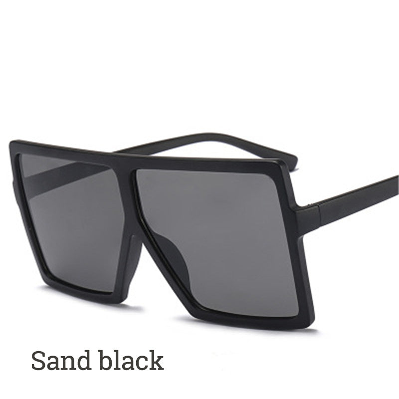 Black sunglasses with dark lenses on a white background