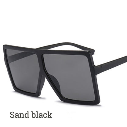 Black sunglasses with dark lenses on a white background