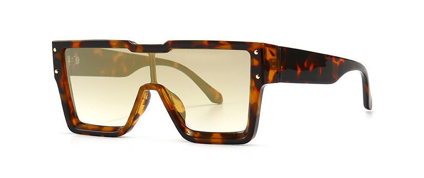 Sunglasses with tortoiseshell frame and gold lenses on a white background