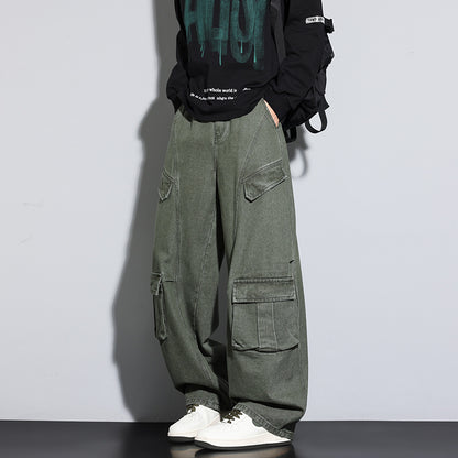 Person wearing green cargo pants and a black hoodie with text on a plain background