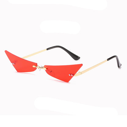 Sunglasses with red triangular lenses and black and gold frames on a white background