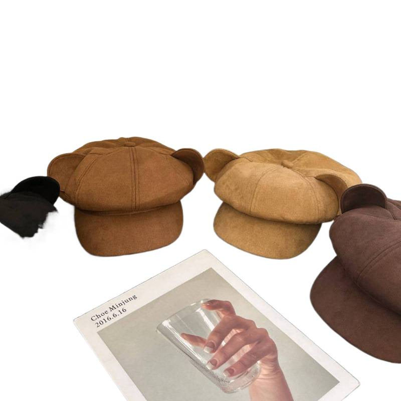 Three brown hats displayed with a card featuring a hand holding a phone on a white background.